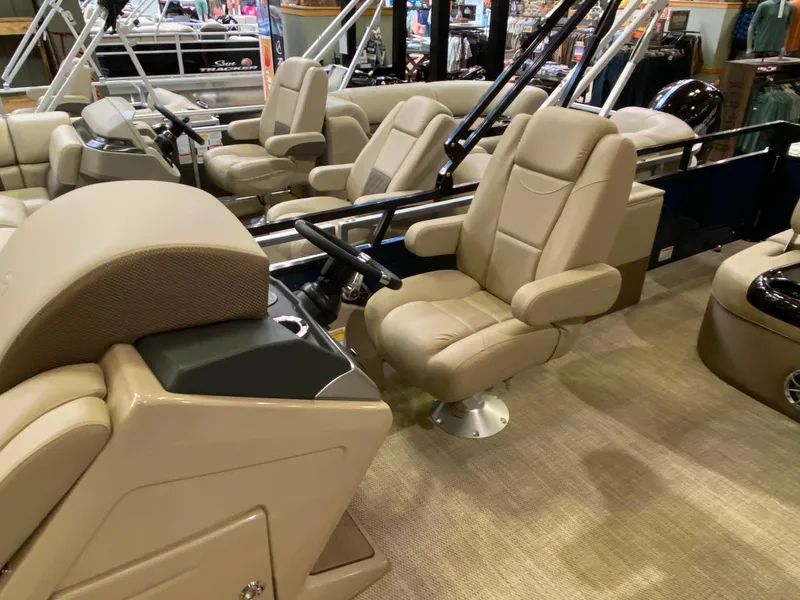 Slide: The Image of 2025 Regency 250 DL3 boat interior with beige seating and modern design. - 4