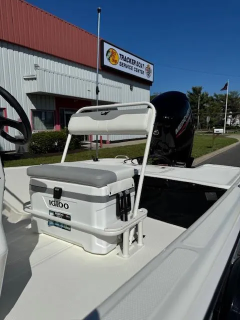 Slide: The Image of 2025 Mako Pro Skiff 17 CC with Igloo cooler at Tracker Boat Service Center. - 4