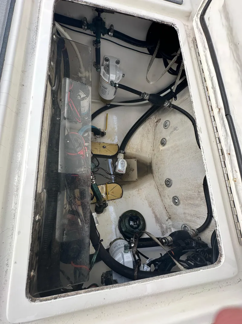 Slide: The Image of 2003 Regulator 26 Center Console boat interior wiring and components. - 25