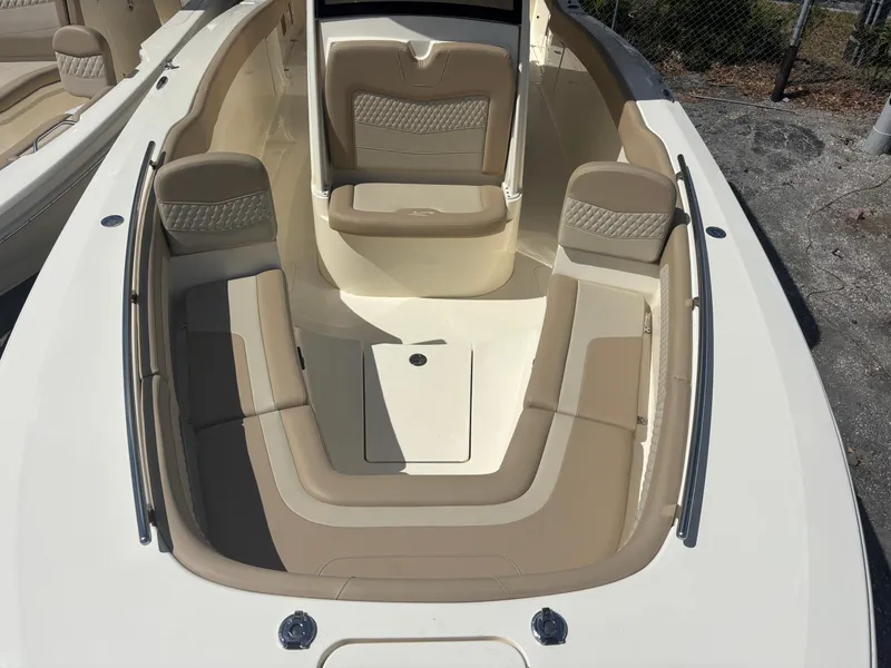 Slide: The Image of 2025 Scout 277 LXF boat interior with beige seating and sleek design. - 10
