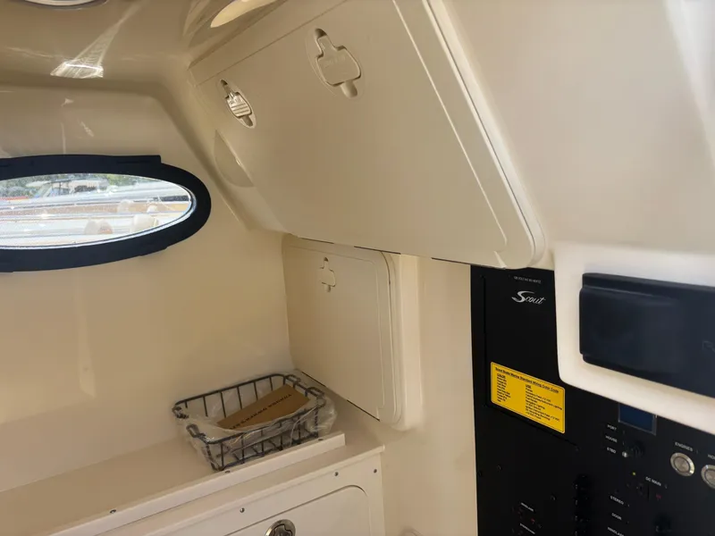 Slide: The Image of Interior cabin of 2025 Scout 277 LXF boat with storage compartments. - 13