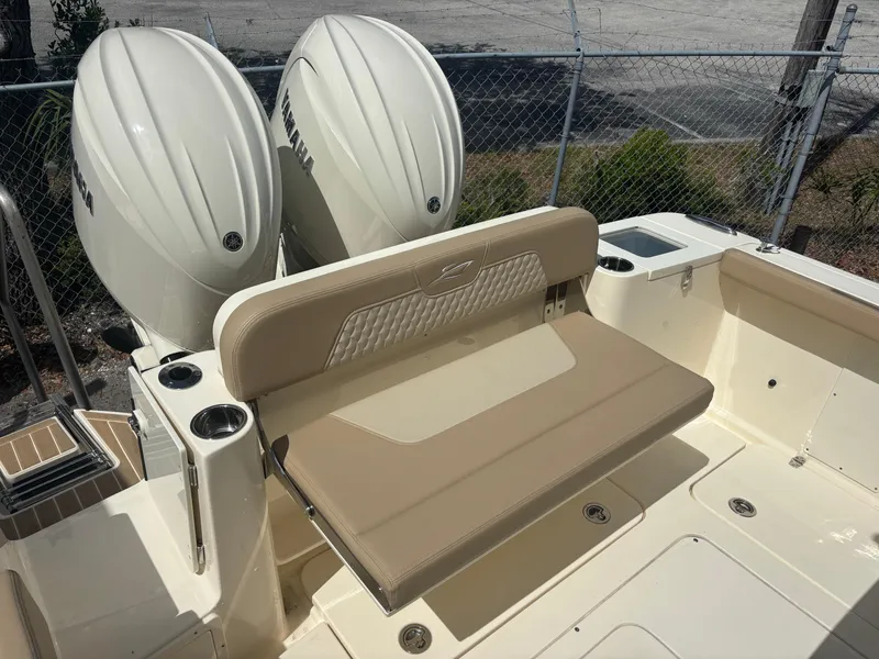 Slide: The Image of 2025 Scout 277 LXF boat with dual Yamaha engines and beige seating. - 4
