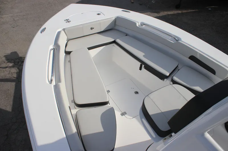 Slide: The Image of 2025 Sea Pro 202 CC boat interior with cushioned seating and sleek design. - 16
