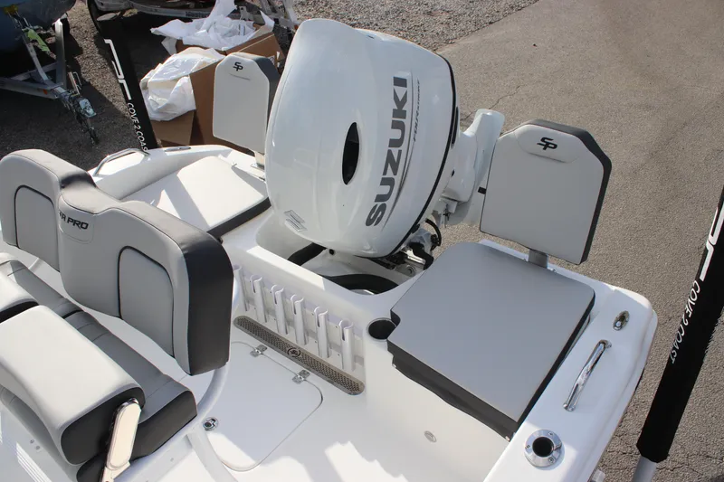 Slide: The Image of 2025 Sea Pro 202 CC boat with Suzuki outboard motor, featuring sleek seating and storage. - 17