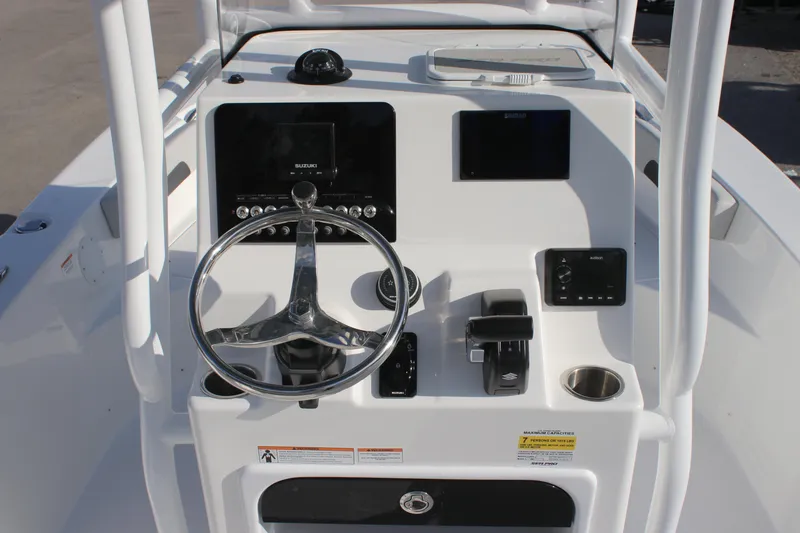 Slide: The Image of 2025 Sea Pro 202 CC boat console with steering wheel and navigation controls. - 6