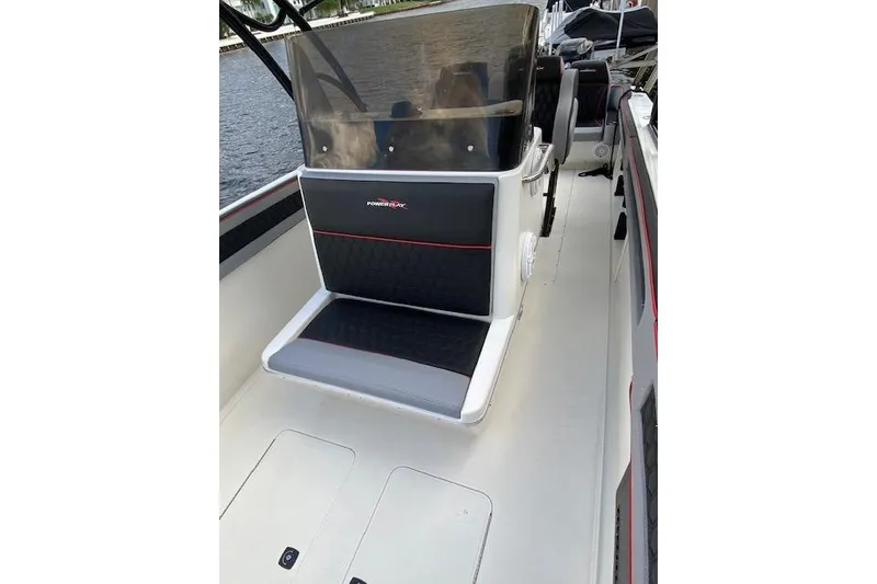 Slide: The Image of 1996 Powerplay Powerboats 33 Sportfish interior with seating and console. - 13