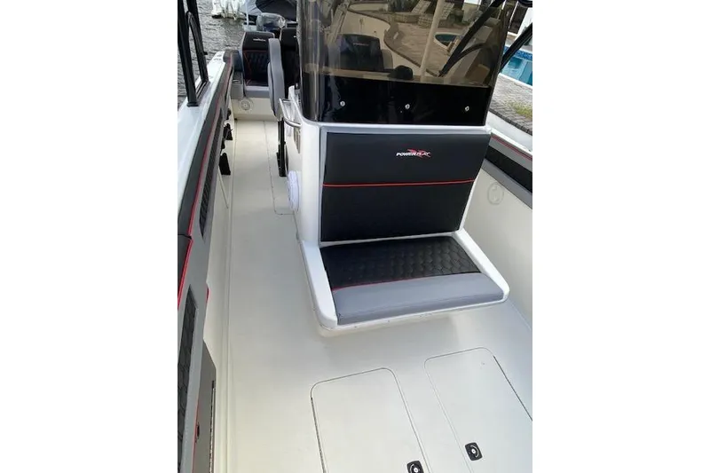 Slide: The Image of 1996 Powerplay Powerboats 33 Sportfish interior with seating and console view. - 14