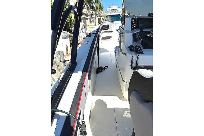 Slide: The Image of 1996 Powerplay Powerboats 33 Sportfish interior with helm and seating area. - 19