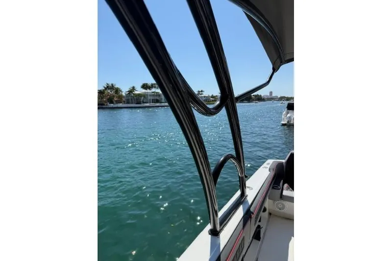 Slide: The Image of 1996 Powerplay Powerboats 33 Sportfish on water, sunny day, view from deck. - 21