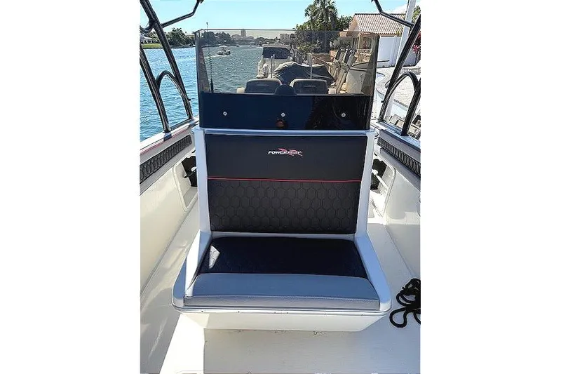 Slide: The Image of 1996 Powerplay Powerboats 33 Sportfish interior with seating and water view. - 26