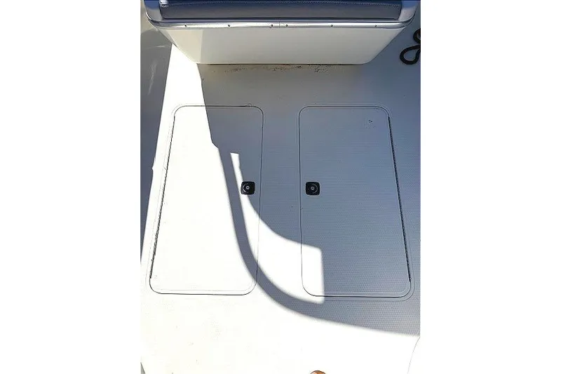 Slide: The Image of 1996 Powerplay Powerboats 33 Sportfish deck with storage compartments. - 28