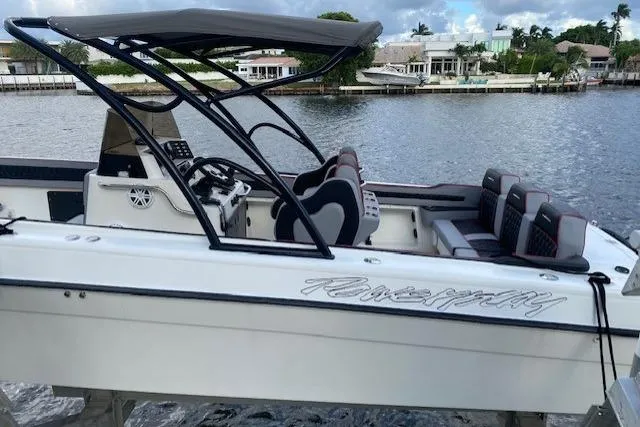 Slide: The Image of 1996 Powerplay Powerboats 33 Sportfish on water, featuring sleek design and comfortable seating. - 3