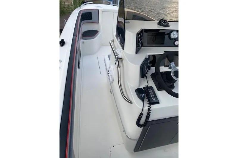 Slide: The Image of 1996 Powerplay Powerboats 33 Sportfish cockpit with steering wheel and controls. - 6