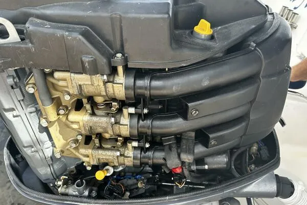 Slide: The Image of Close-up of a 2004 World Cat 270 TE Tournament Edition engine components. - 14