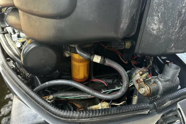 Slide: The Image of Close-up of a 2004 World Cat 270 TE engine components and wiring. - 15