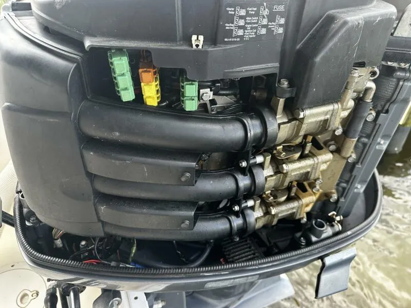 Slide: The Image of Close-up of a 2004 World Cat 270 TE Tournament Edition boat engine components. - 16