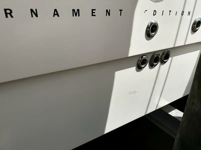 Slide: The Image of 2004 World Cat 270 TE Tournament Edition boat detail with visible fittings and partial lettering. - 19