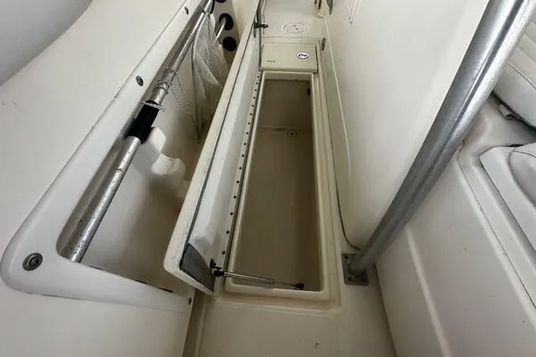 Slide: The Image of 2004 World Cat 270 TE Tournament Edition boat storage compartment open. - 34