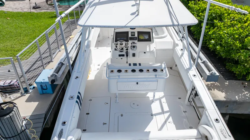 Slide: The Image of 2008 Intrepid 370 Cuddy boat with spacious deck and modern controls. - 13