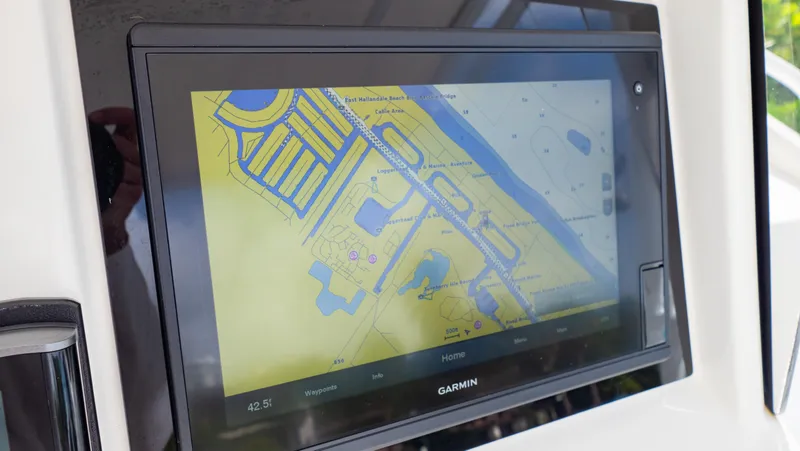 Slide: The Image of Garmin navigation display on 2008 Intrepid 370 Cuddy boat, showing detailed waterway map. - 19