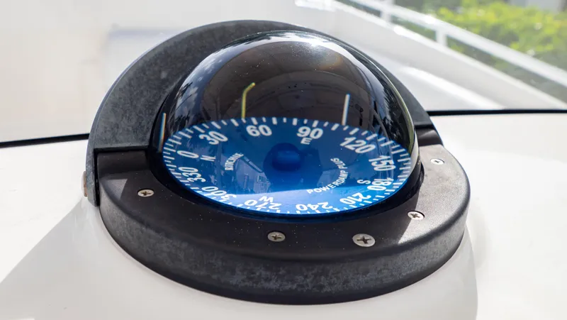 Slide: The Image of Compass on 2008 Intrepid 370 Cuddy boat, displaying navigational directions. - 20