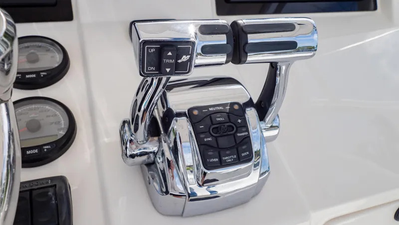 Slide: The Image of Chrome throttle controls on a 2008 Intrepid 370 Cuddy boat dashboard. - 21