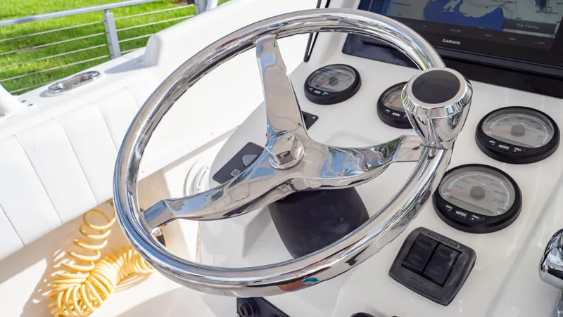 Slide: The Image of Steering wheel and dashboard of a 2008 Intrepid 370 Cuddy boat. - 22