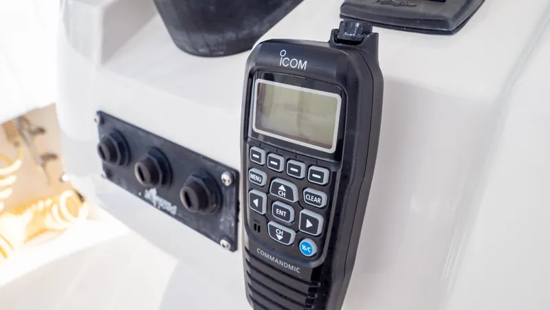 Slide: The Image of ICOM marine radio on 2008 Intrepid 370 Cuddy boat dashboard. - 23