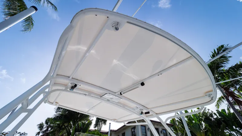 Slide: The Image of 2008 Intrepid 370 Cuddy boat canopy against a clear blue sky. - 30