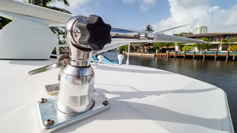 Slide: The Image of Close-up of a 2008 Intrepid 370 Cuddy boat's deck hardware by the water. - 31