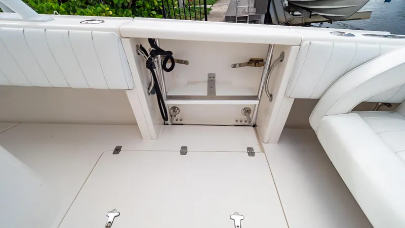 Slide: The Image of 2008 Intrepid 370 Cuddy boat interior with storage compartment and seating. - 36
