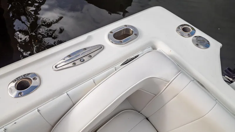 Slide: The Image of 2008 Intrepid 370 Cuddy boat interior with white seating and stainless steel fixtures. - 47