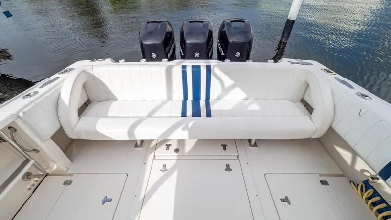 Slide: The Image of 2008 Intrepid 370 Cuddy boat with triple outboard engines and spacious seating. - 5