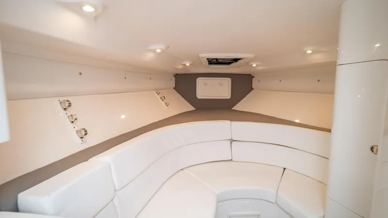 Slide: The Image of 2008 Intrepid 370 Cuddy interior with white seating and modern lighting. - 9