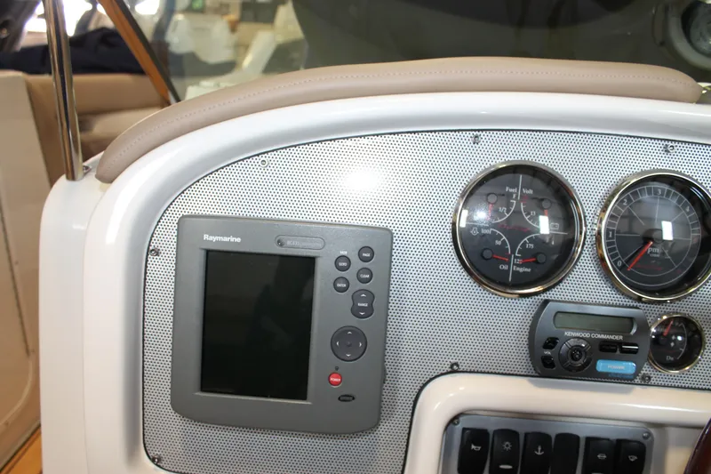 Slide: The Image of 2007 Chris-Craft Launch 28 dashboard with navigation system and gauges. - 26