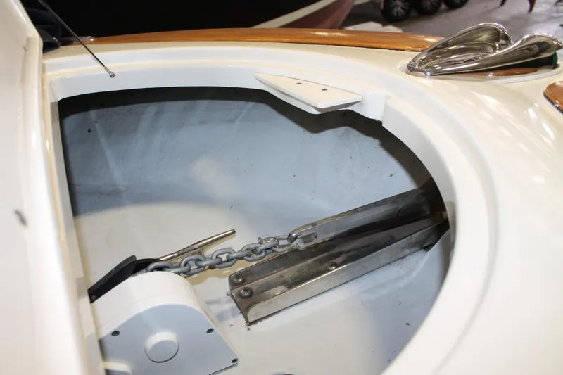 Slide: The Image of Anchor compartment of 2007 Chris-Craft Launch 28 boat, featuring chain and metal fittings. - 9
