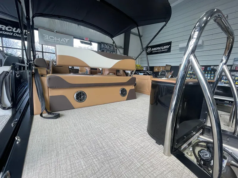 Slide: The Image of 2025 Tahoe Pontoon 2185 LTZ interior with tan seating and modern design. - 4