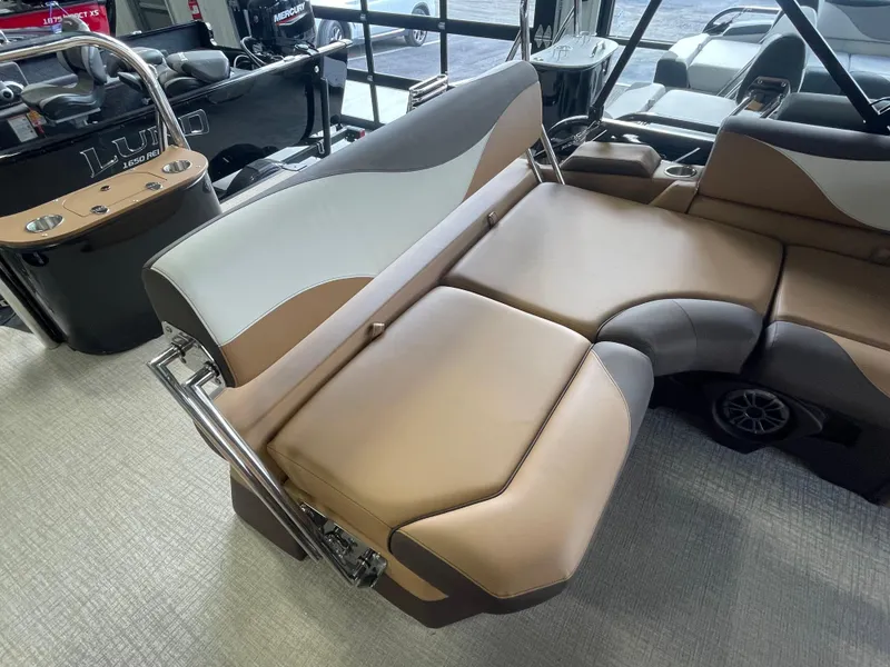 Slide: The Image of 2025 Tahoe Pontoon 2185 LTZ interior with luxurious tan and gray seating. - 8