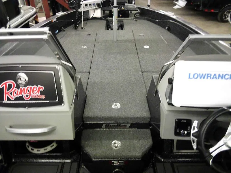 Slide: The Image of 2024 Ranger 622FS Pro DC boat interior with Lowrance electronics and spacious deck. - 10
