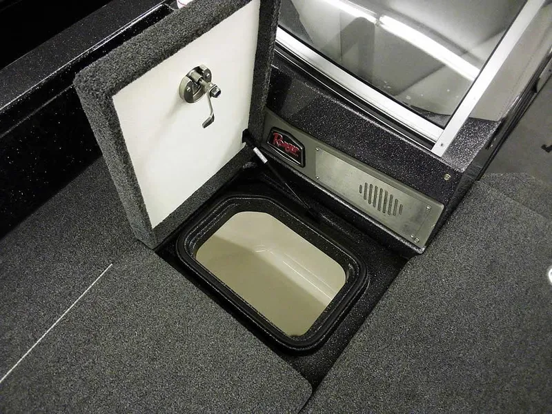 Slide: The Image of 2024 Ranger 622FS Pro DC boat storage compartment with open hatch and secure latch. - 13
