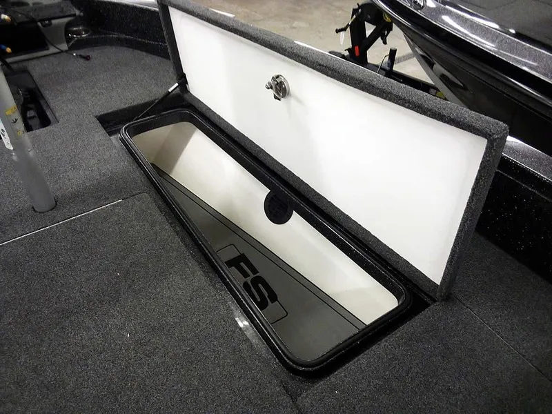 Slide: The Image of 2024 Ranger 622FS Pro DC boat storage compartment with open lid, showcasing interior space. - 14