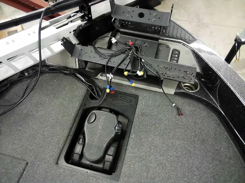 Slide: The Image of 2024 Ranger 622FS Pro DC boat interior with wiring and pedal setup. - 18