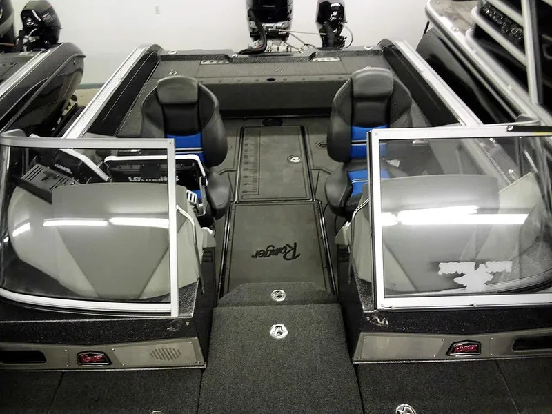 Slide: The Image of 2024 Ranger 622FS Pro DC boat interior with dual consoles and seating. - 20