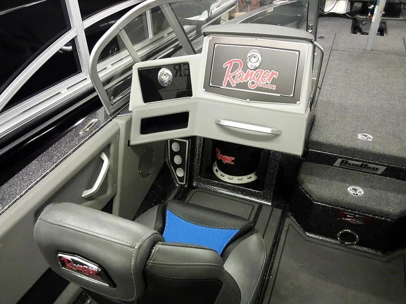 Slide: The Image of 2024 Ranger 622FS Pro DC boat interior with modern dashboard and seating. - 21