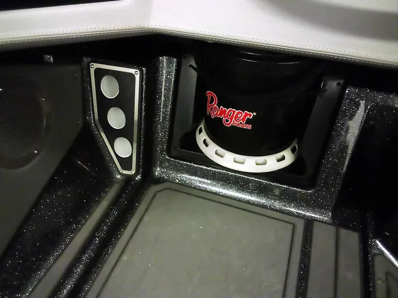 Slide: The Image of 2024 Ranger 622FS Pro DC boat interior with storage compartment and branded bucket. - 22