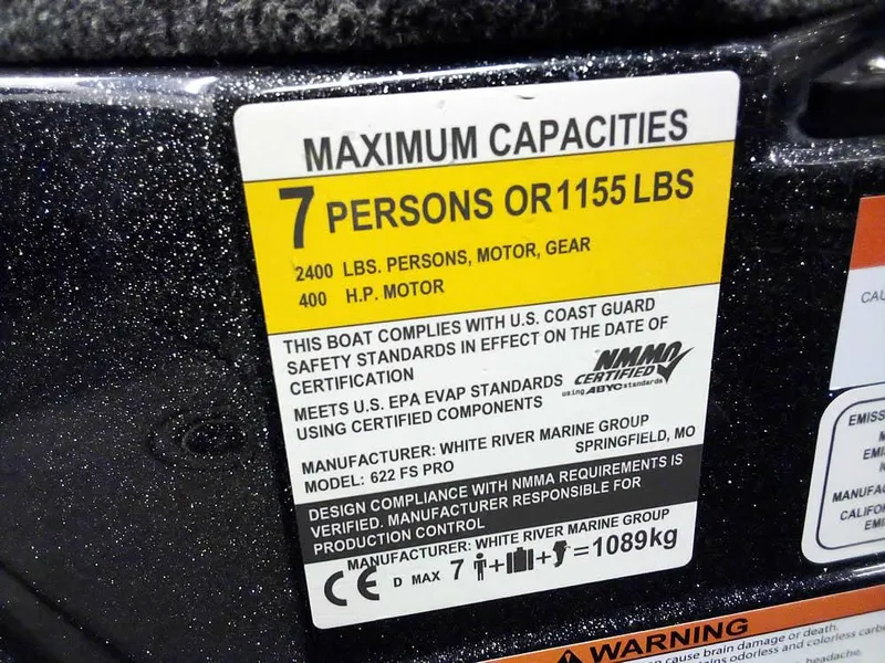 Slide: The Image of 2024 Ranger 622FS Pro DC capacity label, 7 persons or 1155 lbs, 400 HP motor. - 25