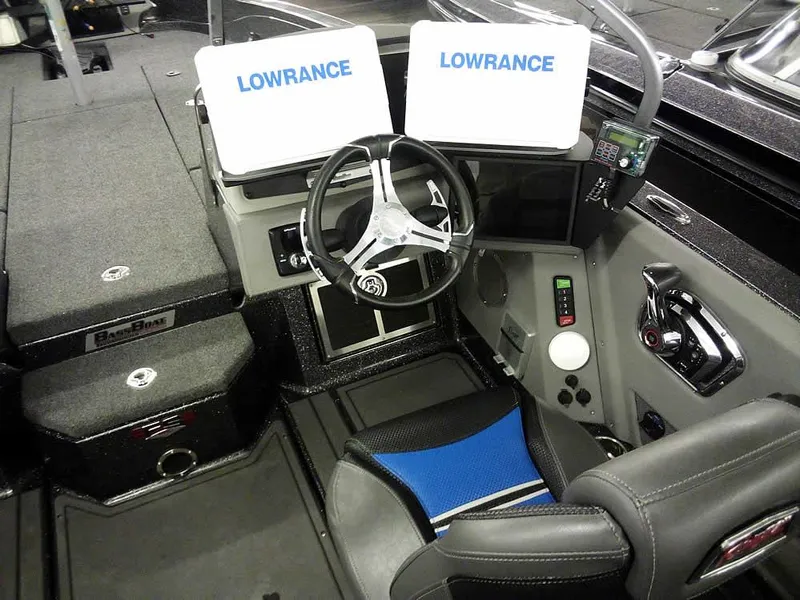 Slide: The Image of 2024 Ranger 622FS Pro DC boat cockpit with dual Lowrance displays and modern steering wheel. - 26