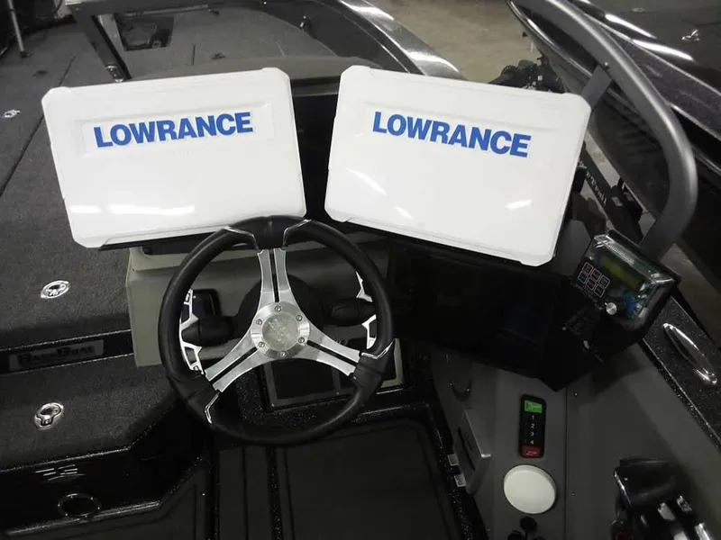 Slide: The Image of 2024 Ranger 622FS Pro DC boat dashboard with dual Lowrance displays and steering wheel. - 27