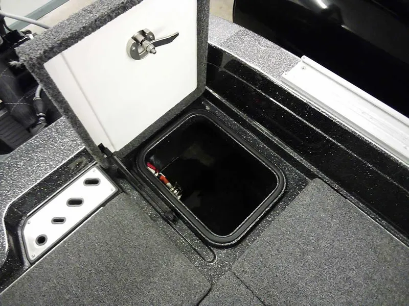 Slide: The Image of 2024 Ranger 622FS Pro DC boat storage compartment with open hatch and secure latch. - 35