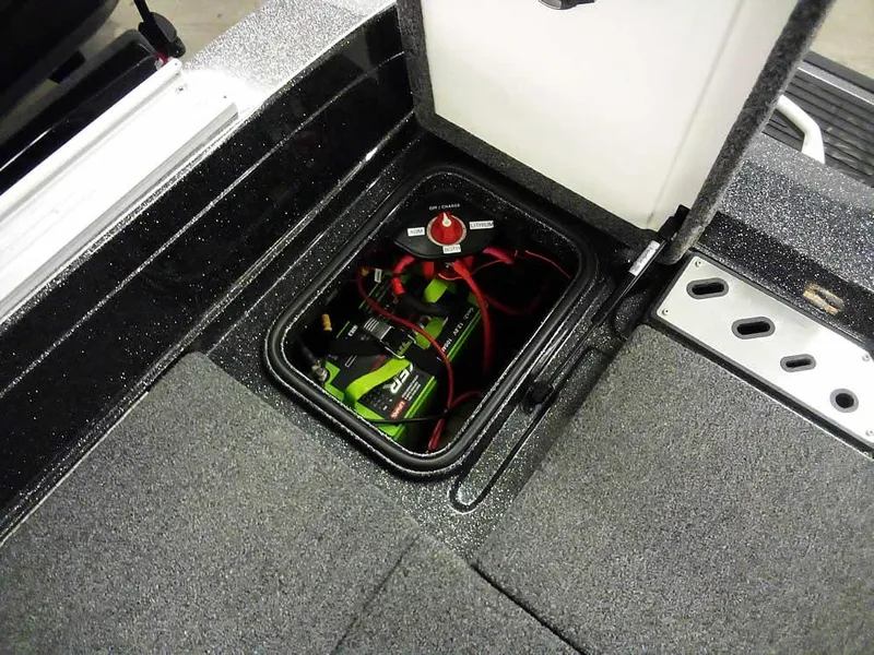 Slide: The Image of 2024 Ranger 622FS Pro DC boat battery compartment with wiring and switch. - 36